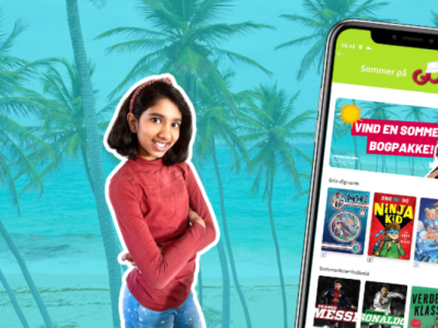 Pige og mobiltelefon med Ereolen GO. Foto: PR EreolenGO